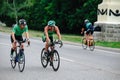 Triathon biking cyclist triathlete riding racing bike during ironman competition