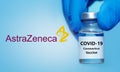 Kharkiv. Ukraine. December 24, 2020. Covid-19 vaccine with AstraZeneca logo.Doctor`s hand in a medical glove holds a bottle with Royalty Free Stock Photo