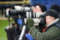 KHARKIV, UKRAINE - February 14, 2019: Photographers, journalists with cameras shoot a match during the UEFA Europa League match