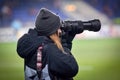 KHARKIV, UKRAINE - February 14, 2019: Photographers, journalists with cameras shoot a match during the UEFA Europa League match