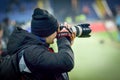 KHARKIV, UKRAINE - February 14, 2019: Photographers, journalists with cameras shoot a match during the UEFA Europa League match