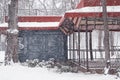 Kharkiv, Ukraine - February 1st, 2021: Winter day in Kharkiv city park. Terrace of the street cafe in the snowfall Royalty Free Stock Photo