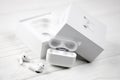 KHARKIV, UKRAINE - JANUARY 27, 2021: Apple AirPods Pro on a white background. Wireless headphones with charging case and a box. Royalty Free Stock Photo