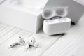 KHARKIV, UKRAINE - JANUARY 27, 2021: Apple AirPods Pro on a white background. Wireless headphones with charging case and a box. Royalty Free Stock Photo
