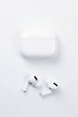 KHARKIV, UKRAINE - JANUARY 27, 2021: Apple AirPods Pro on a white background. Wireless headphones with charging case and a box. Royalty Free Stock Photo