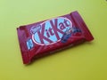 KHARKIV, UKRAINE - JANUARY 2, 2021 Kit Kat by Nestle chocolate covered wafer on bright color