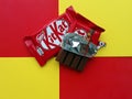 KHARKIV, UKRAINE - JANUARY 2, 2021 Kit Kat by Nestle chocolate covered wafer on bright color