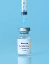 Kharkiv. Ukraine. January 9, 2021. Syringe, Coronavirus vaccine vial with AstraZeneca logo a blue background.The concept of Royalty Free Stock Photo