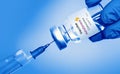 Kharkiv. Ukraine. January 9, 2021. Syringe, Coronavirus vaccine vial with AstraZeneca logo a blue background.The concept of Royalty Free Stock Photo