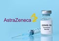 Kharkiv. Ukraine. January 9, 2021. Syringe, Coronavirus vaccine vial with AstraZeneca logo a blue background.The concept of Royalty Free Stock Photo