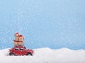 Creative Christmas background with toy retro car Volkswagen Beetle and presents