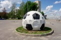 Kharkiv, Ukraine, July, 2019 Football ball installation near sport complex and stadium. City landscape in summer day. Decorated