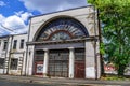 Old industrial building with large arched windows on Chervoni Ryady Street in Kharkov. Cityscape