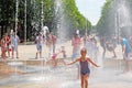 Hot summer day, a fountain in the center of the park. Royalty Free Stock Photo