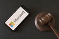 KHARKIV, UKRAINE - JUNE 25, 2020: Microsoft Corporation logo on screen of mobile device. Disputes and lawsuits against Microsoft