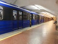 Kharkiv, Ukraine June 17, 2020 - Platform and subway cars, passengers in medical masks inside the subway car Royalty Free Stock Photo