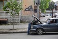 Man under the hood repairing his old car soviet Volga