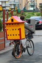 Kharkiv, Ukraine - October 26, 2013: A man walks his bike with a portable dovecot on the rack, promoting pigeon keeping and
