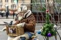 An old man playing a mechanical organ in a modern city Royalty Free Stock Photo