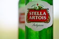Bottles of Stella Artois beer on blurred green trees background Royalty Free Stock Photo