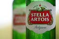 Bottles of Stella Artois beer on blurred green trees background Royalty Free Stock Photo