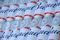 Many Cans of Budweiser Lager Alcohol Beer lies on camo surface. Budweiser is Brand from Anheuser-Busch Inbev most popular in