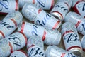 Many Cans of Budweiser Lager Alcohol Beer lies on camo surface. Budweiser is Brand from Anheuser-Busch Inbev most popular in