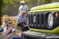 Suzuki logo in yellow car front part close up outdoors