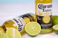 KHARKOV UKRAINE - DECEMBER 9 2020: Bottles of Corona Extra Beer with lime slices. Corona produced by Grupo Modelo with Anheuser