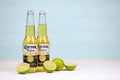 KHARKOV UKRAINE - DECEMBER 9 2020: Bottles of Corona Extra Beer with lime slices. Corona produced by Grupo Modelo with Anheuser