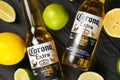 KHARKOV UKRAINE - DECEMBER 9 2020: Bottles of Corona Extra Beer with lime slices. Corona produced by Grupo Modelo with Anheuser