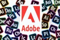 KHARKOV, UKRAINE - DECEMBER 26, 2020: Paper logos of most popular adobe products on white background. Photoshop illustrator bridge