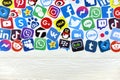 KHARKOV UKRAINE - DECEMBER 26 2020: Paper logos of most popular social networks and mobile messengers on wooden background.