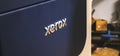 Kharkov, Ukraine - December 24, 2021: Xerox logo close-up. Large high volume printer in print house workshop