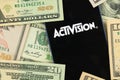 Kharkov, Ukraine - January 19, 2021: Activision and money, dollars background