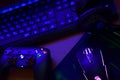 Gamesir g3s video game controller and Bloody p93 gaming mouse on office table with a4tech keyboard and headphones