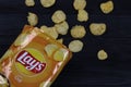 KHARKOV, UKRAINE - JANUARY 3, 2021: Lays potato chips with cheese flavour and original lays logo in middle of package. Worldwide Royalty Free Stock Photo