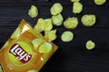 KHARKOV, UKRAINE - JANUARY 3, 2021: Lays potato chips with cheese flavour and original lays logo in middle of package. Worldwide Royalty Free Stock Photo