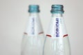 KHARKOV, UKRAINE - JULY 2, 2021: Glass of Borjomi brand of naturally carbonated mineral water from springs in Borjomi Gorge of