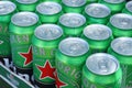 KHARKOV, UKRAINE - JULY 31, 2021: Green tin cans of Heineken lager beer produced by the Dutch brewing company Heineken N.V