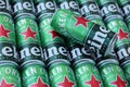 KHARKOV, UKRAINE - JULY 31, 2021: Green tin cans of Heineken lager beer produced by the Dutch brewing company Heineken N.V
