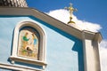 Close-up of the two domes of the church with golden crosses against the blue sky with clouds, soft focus Royalty Free Stock Photo