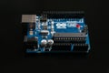 Arduino UNO board on black background Royalty Free Stock Photo