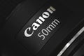 Kharkov, Ukraine - March 7, 2021: Canon 50mm most popular portrait lens, brand logo close up Royalty Free Stock Photo