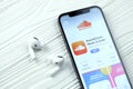 KHARKOV, UKRAINE - MARCH 5, 2021: Soundcloud icon and application from App store on iPhone 12 pro display screen with airpods pro