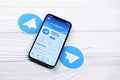 KHARKOV, UKRAINE - MARCH 5, 2021: Telegram Messenger icon and application from App store on iPhone 12 pro display screen on white Royalty Free Stock Photo