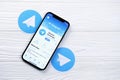 KHARKOV, UKRAINE - MARCH 5, 2021: Telegram Messenger icon and application from App store on iPhone 12 pro display screen on white Royalty Free Stock Photo