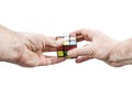 Kharkov, Ukraine - May 31, 2018: Hands collect the Rubik cube Royalty Free Stock Photo