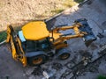 KHARKOV, UKRAINE - MAY 2020. Hydraulic Excavator Removing Remains of asphalt. Road reconstruction. Pavement repair