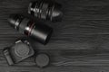 Canon EOS R photocamera and mount adapter EF - EOS R with Canon 105mm f2.8 and Sigma 24-105 f4 Art lenses on black wooden table